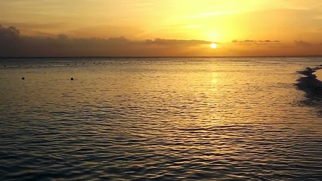 Golden sunrise sunset over the sea ocean.