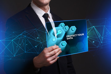 Business, Technology, Internet and network concept. Young businessman working on a virtual screen of the future and sees the inscription: Protect your data