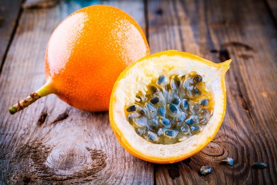 Organic raw ripe yellow granadilla passion fruit