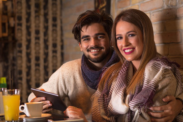 Beautiful young couple in cafe.