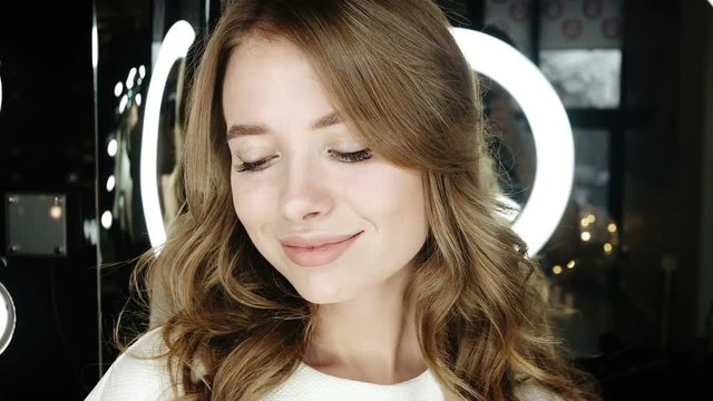 Beautiful woman smiling. Professional fashion model looking into the camera. Portrait of young happy beautiful woman