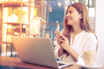 Asian woman working in coffee shop