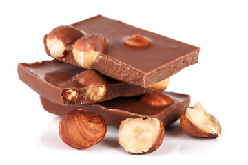 Chocolate with hazelnuts isolated on white background