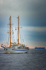 Fototapeta na wymiar White sailing ship coming from Baltic sea, Europe