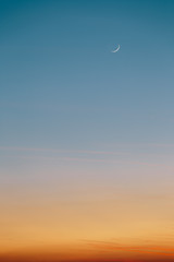 Thin moon during sunset