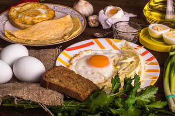 Obraz na płótnie Canvas Different cooking eggs on a wooden background
