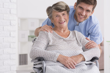 Senior care assistant with disabled woman