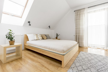 Fototapeta na wymiar Bright bedroom with double bed