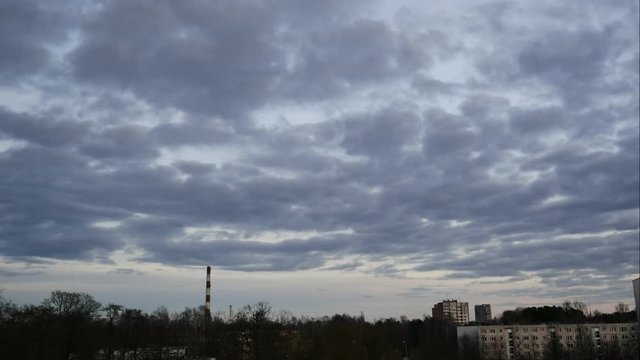 Sunset Time Lapse Sky and moving clouds Power Plant pipe with smoke Latvia 4K