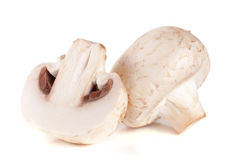 champignon mushrooms and half isolated on white background