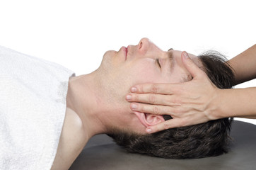 Chiropractor assessing the muscles on a jaw