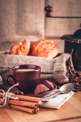 Cup fragrant hot coffee with bean chocolate sweet and loaf
