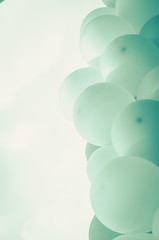 pink balloons background over pastel cloud