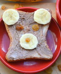 Beautiful children's sandwich teddy bear on a red plate