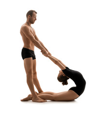 Man and woman doing sports exercises in studio