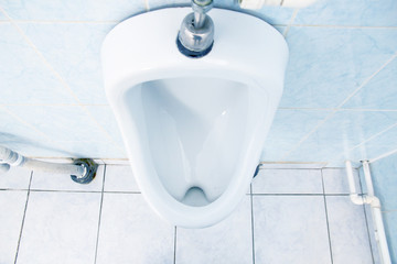 White urinal in man's toilet