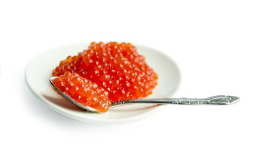 Red caviar in a spoon, isolated white background, close up