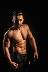 Fototapeta na wymiar handsome muscular macho man with sexy athlete body in pants
