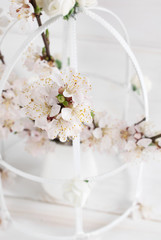 Apricot flowers in vase and old vintage casket with rose in Shabby Chic style