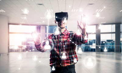 Guy wearing checked shirt and virtual mask reaching hand to touc