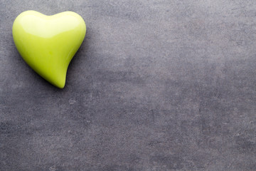 Obraz premium Colored heart on the gray background. View from above. Flat lay.