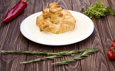 Pot pie with meat on white plate