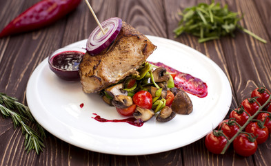 Delicious beef steak. Grilled beef steak with tomato and Mushrooms