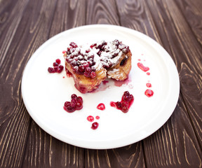 Berries puff pastry pie on wooden table