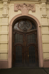 Fototapeta na wymiar Arched door with stained glass window
