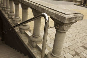 stainless steel handrails with the plaster staircase