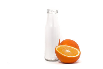 Orange fruit and empty bottle isolated on white background