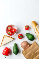 vegetables and bread on white desk background top view mock-up