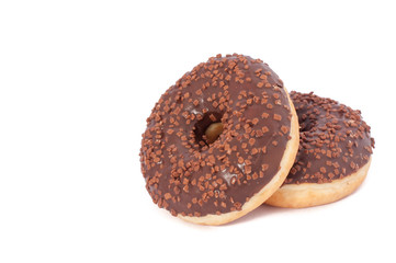 Two Chocolate Donuts with Sprinkles. Isolated on a White Background