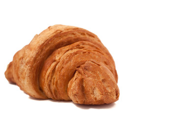 Fresh and tasty croissant over isolated white background