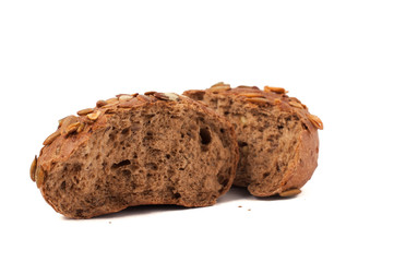 round a bun with pumpkin seeds wherein is isolated on a white background