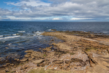 a piece of rocky land going into north sea 