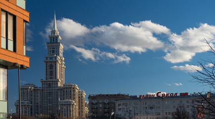 Moscow, Sokol district panorama, Title of the district on the roof at clear sky. Triumph-palace on the left
