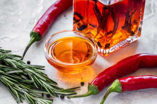 natural oils concept with fresh chili paper on table background