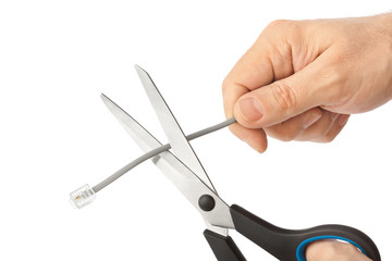 Hand with scissors and phone cable