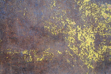 rusted train car with worn yellow paint