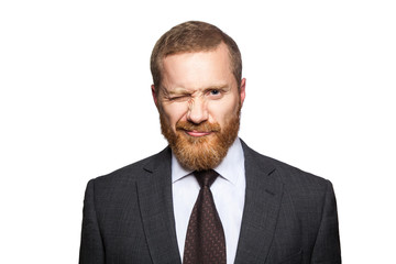 Funny handsome businessman looking at camera and winking. isolated on white, looking at camera..