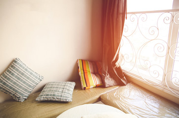 Interior design with pillow and window with sunlight