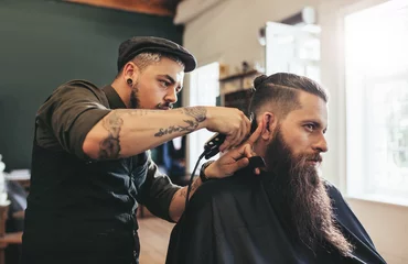 Gordijnen Man getting trendy haircut in barbershop © Jacob Lund
