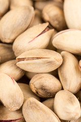 Pile of roasted pistachio on the wooden table