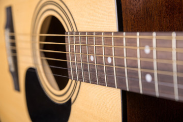 Fototapeta premium Wooden acoustic guitar isolated with a large horizontal plan