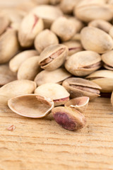 Pile of roasted pistachio on the wooden table