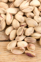 Pile of roasted pistachio on the wooden table