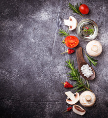 Mushrooms, tomatoes, rosemary, salt and oil. Food background
