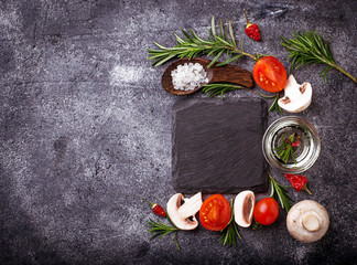 Mushrooms, tomatoes, rosemary, salt and oil. Food background