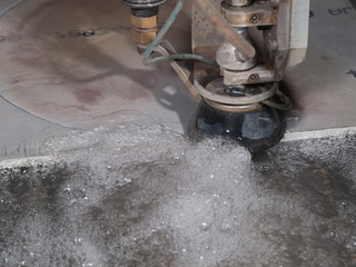 water pressure cutting through stainless steel materials